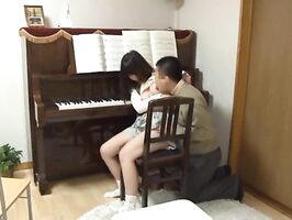Piano teacher rear fucks his pupil across the piano keys